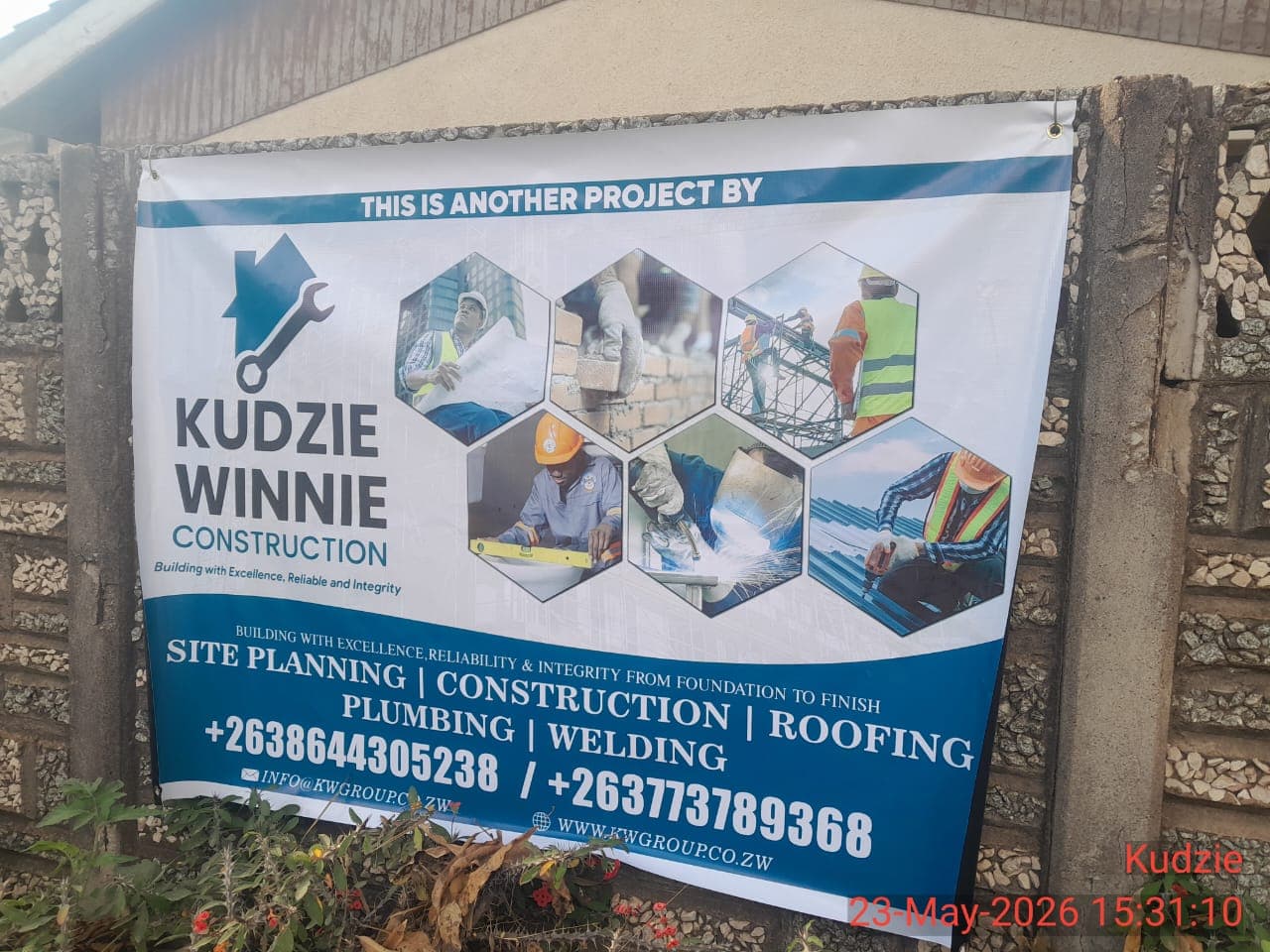 Image of construction workers collaborating on a project.